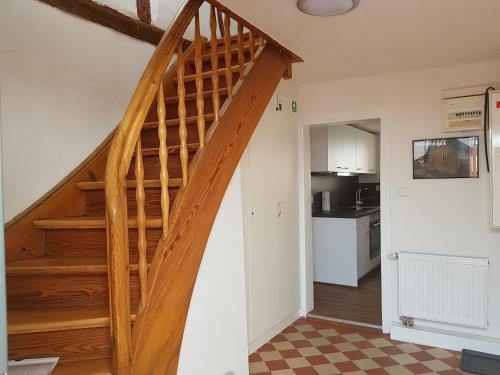 a staircase in a room with a kitchen at Ferienhaus Nr. 10 in Buergstadt