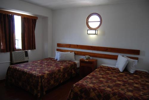Postel nebo postele na pokoji v ubytování Hotel Alux Cancun