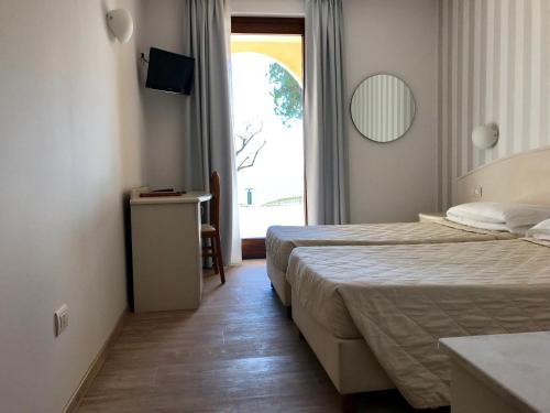 Posteľ alebo postele v izbe v ubytovaní Hotel Roma
