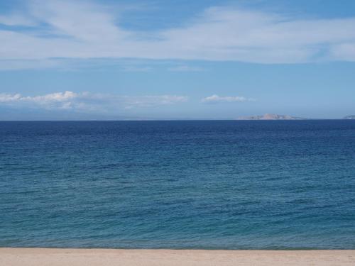 a view of the ocean from the beach at Stazzu Giasti Agriturismo in Aglientu