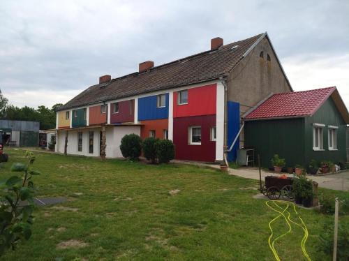 a row of colorful houses in a yard at Mein Marienhof in Bestensee