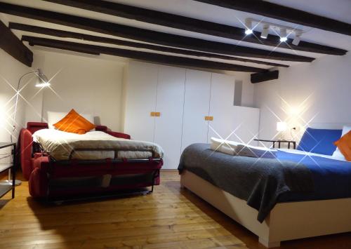 Postel nebo postele na pokoji v ubytování Giudei House Bologna