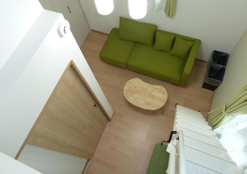 an overhead view of a living room with a green couch at Kanaloa Funabashi in Funabashi