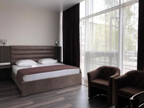 Postel nebo postele na pokoji v ubytování HOTEL VICTORIA CENTER