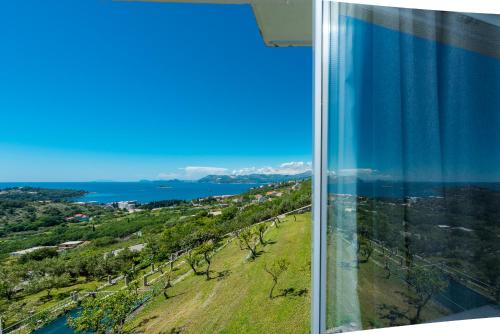 a view of the water from the window of a building at Villa Mimoza in Cavtat