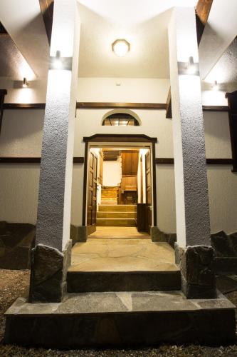 a hallway of a building with a stairway at Guest House Panorama in Gela