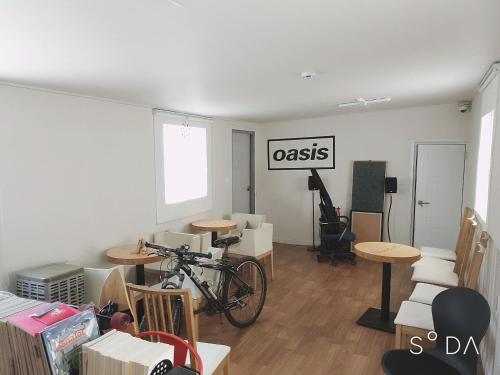 a room with a bike parked in a room with boxes at Haru The Guesthouse in Andong