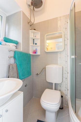 a bathroom with a toilet and a sink at Studio Elly in Dubrovnik