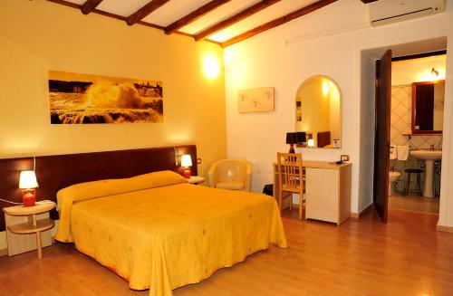 A bed or beds in a room at B&B Viaprimaldo Camere