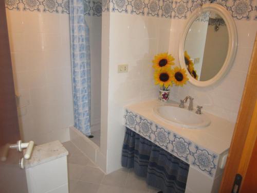 a bathroom with a sink and a mirror at Le Case dei Pescatori - Roseto in Ponza