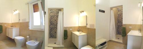 a bathroom with two toilets and a sink and a shower at Pappalardo - Regina Elena in Trapani