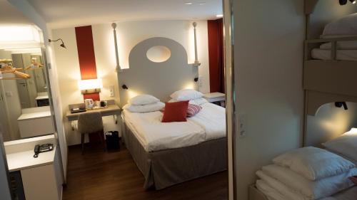 Postel nebo postele na pokoji v ubytování Original Sokos Hotel Seurahuone Kotka
