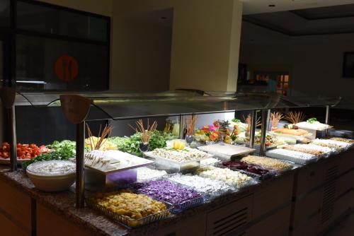 a buffet line with many different types of food at Herakles Thermal Hotel in Pamukkale