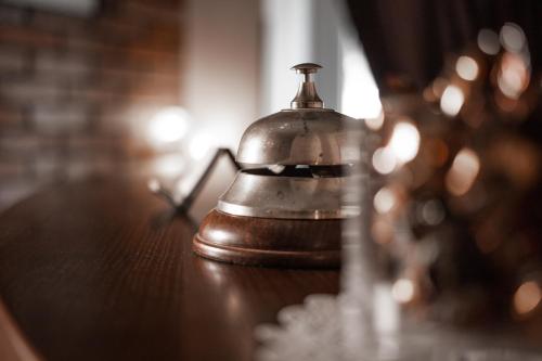 a bell sitting on top of a wooden table at Ekaterinoslav in Dnipro
