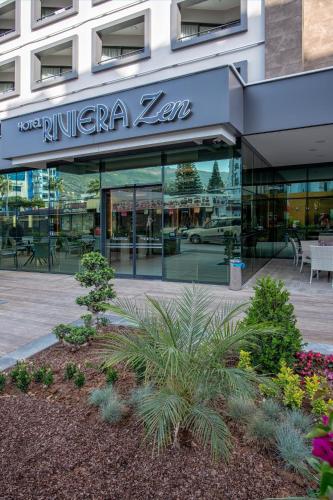 a building with a sign for a kitchen zen at Riviera Zen Hotel Adult Only in Alanya