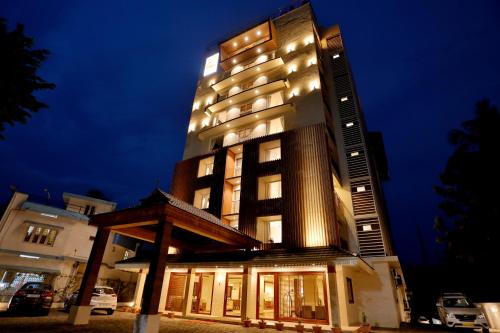 a tall building with lights on top of it at Sterling Thekkady in Thekkady