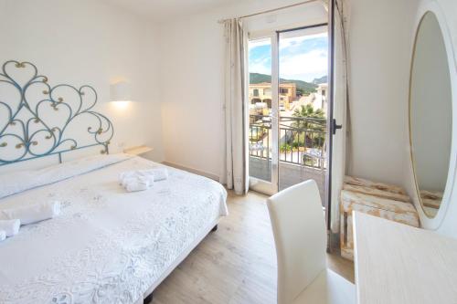 Postel nebo postele na pokoji v ubytování Olbia City Hotel