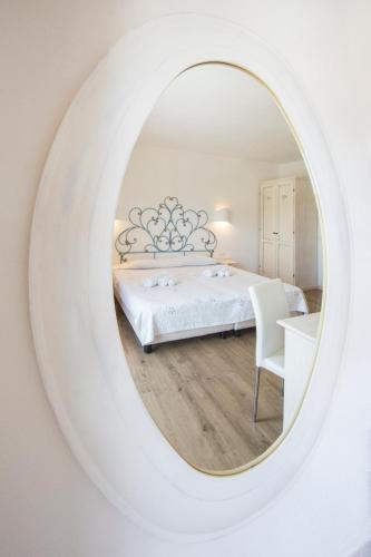 Un ou plusieurs lits dans un hébergement de l'établissement Olbia City Hotel