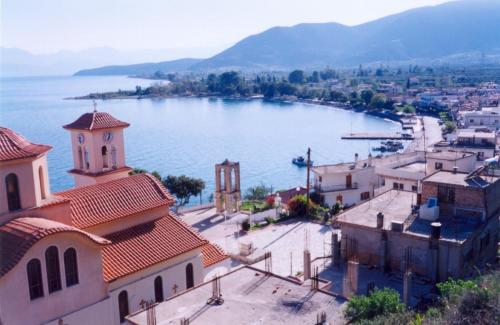 an aerial view of a town next to a lake at Eleftheria's Apartments in Eratini