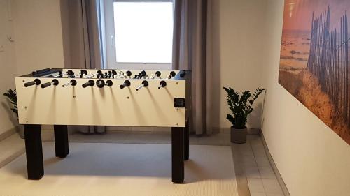 a game of dominoes on a table in a room at Ferienhaus Meeresrauschen in Binz
