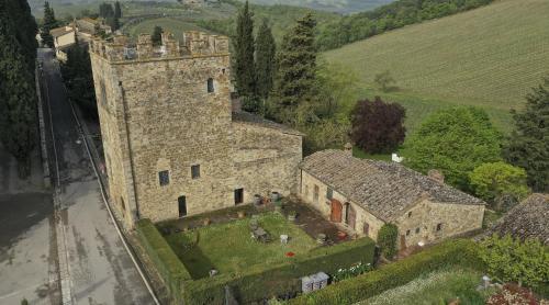 an aerial view of a castle in a field at Torre di Badia in Badia A Passignano