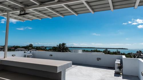 a view of the ocean from the balcony of a house at Arkenstone Studios in La Gaulette