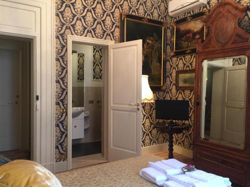 a room with a bathroom with a sink and a mirror at Palazzo Laguardia in Fasano