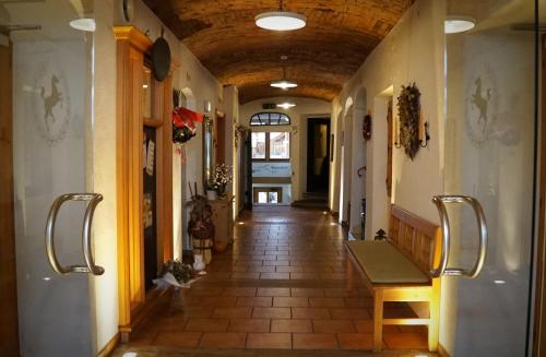 a hallway of a building with a bench in it at Zum schwarzen Rössl in Strengberg