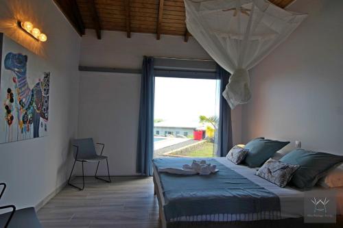 En eller flere senge i et værelse på Résidence Eden Océan avec vue mer