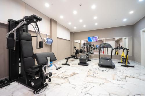 a gym with several exercise equipment in a room at Hotel Milano Castello in Milan