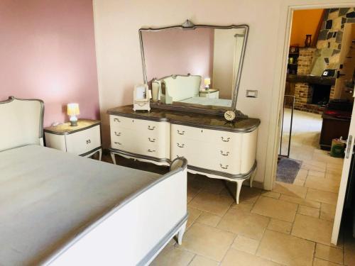 a bedroom with a dresser with a mirror on it at La Bella di Lamezia (Appartamento) in Lamezia Terme