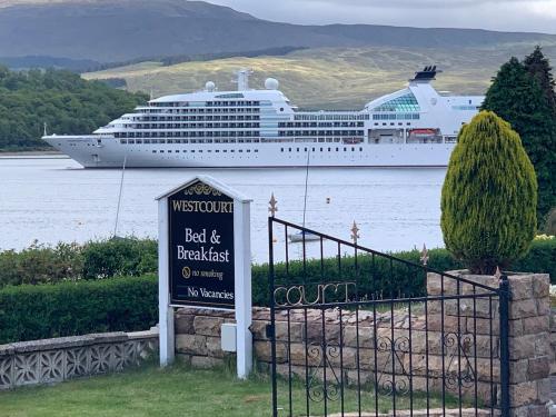 
a cruise ship is docked at the dock at Westcourt Bed & Breakfast in Fort William
