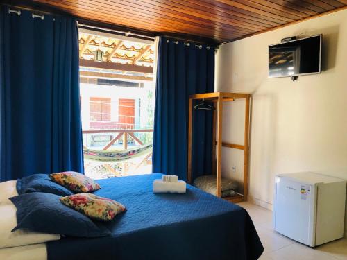 Una cama o camas en una habitación de Pousada Porto do Sol