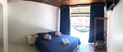 Cama ou camas em um quarto em Pousada Porto do Sol
