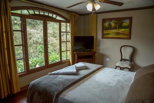 Un pat sau paturi într-o cameră la Posada Real