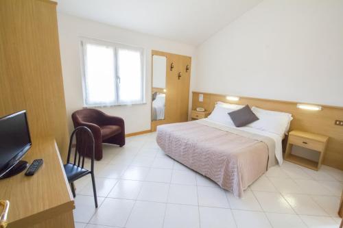 Ένα ή περισσότερα κρεβάτια σε δωμάτιο στο Hotel Villa Elia