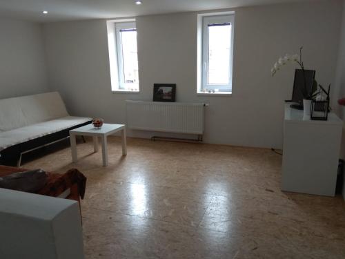 a living room with a couch and a table at Apartmány U splavu in Veselí nad Moravou