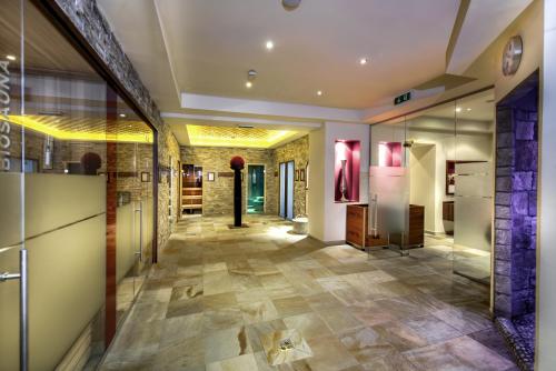 a hallway of a store with a tile floor at Hotel Brigitte in Ischgl