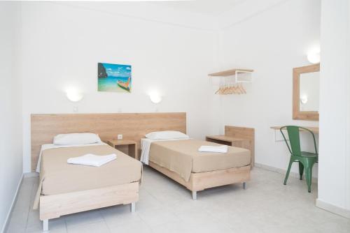 Ένα ή περισσότερα κρεβάτια σε δωμάτιο στο Seaside Resorts