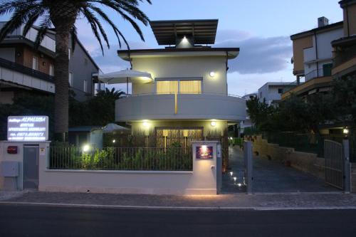 a building with a sign in front of it at Residenza Alpaluba in Vasto