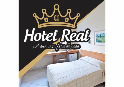 Postel nebo postele na pokoji v ubytování HOTEL REAL