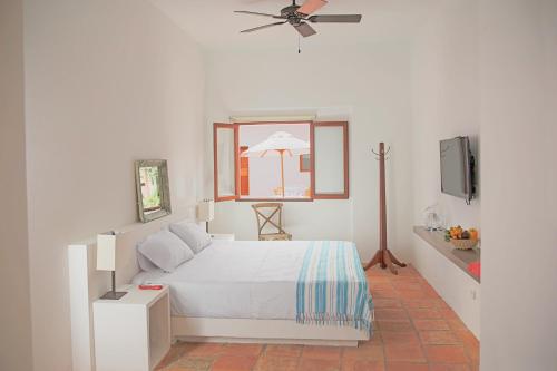 Postel nebo postele na pokoji v ubytování Hotel San German