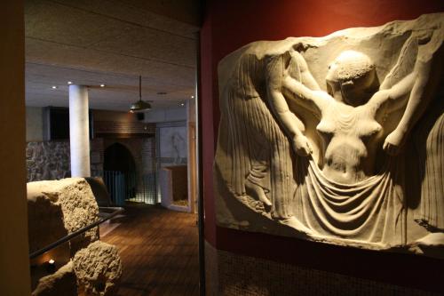 a bas relief of a woman on a wall in a museum at Hotel Spa La Casa Mudéjar in Segovia