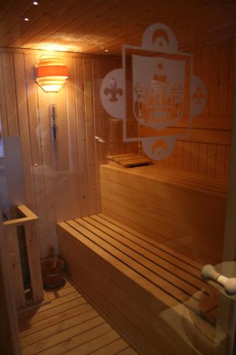 a sauna with a light in a wooden room at Hotel Spa La Casa Mudéjar in Segovia