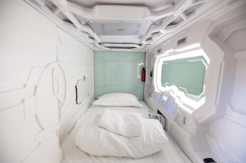 Postel nebo postele na pokoji v ubytování Spacehotel Karlsruhe
