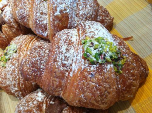a group of pastries sitting on a table at Hotel Sicilya in San Vito lo Capo