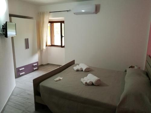 Postel nebo postele na pokoji v ubytování B&b Domo e Nonna