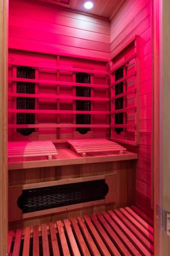 a room with pink lights on the wall at ImPuls | aparts in Schladming