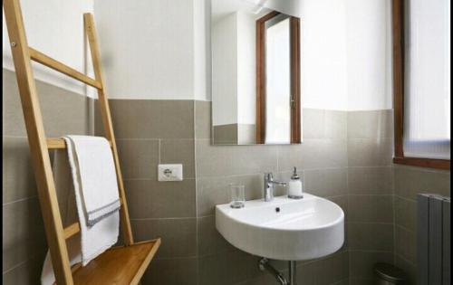 a bathroom with a sink and a mirror at Ca' Cornello in Calco