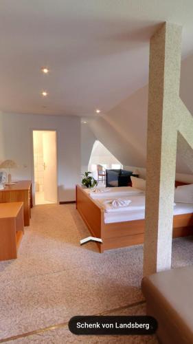 a hotel room with two beds and a staircase at Hotel & Restaurant Schenk von Landsberg in Teupitz
